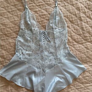 Elegant Lace Trimmed Pale Blue Satin Romper